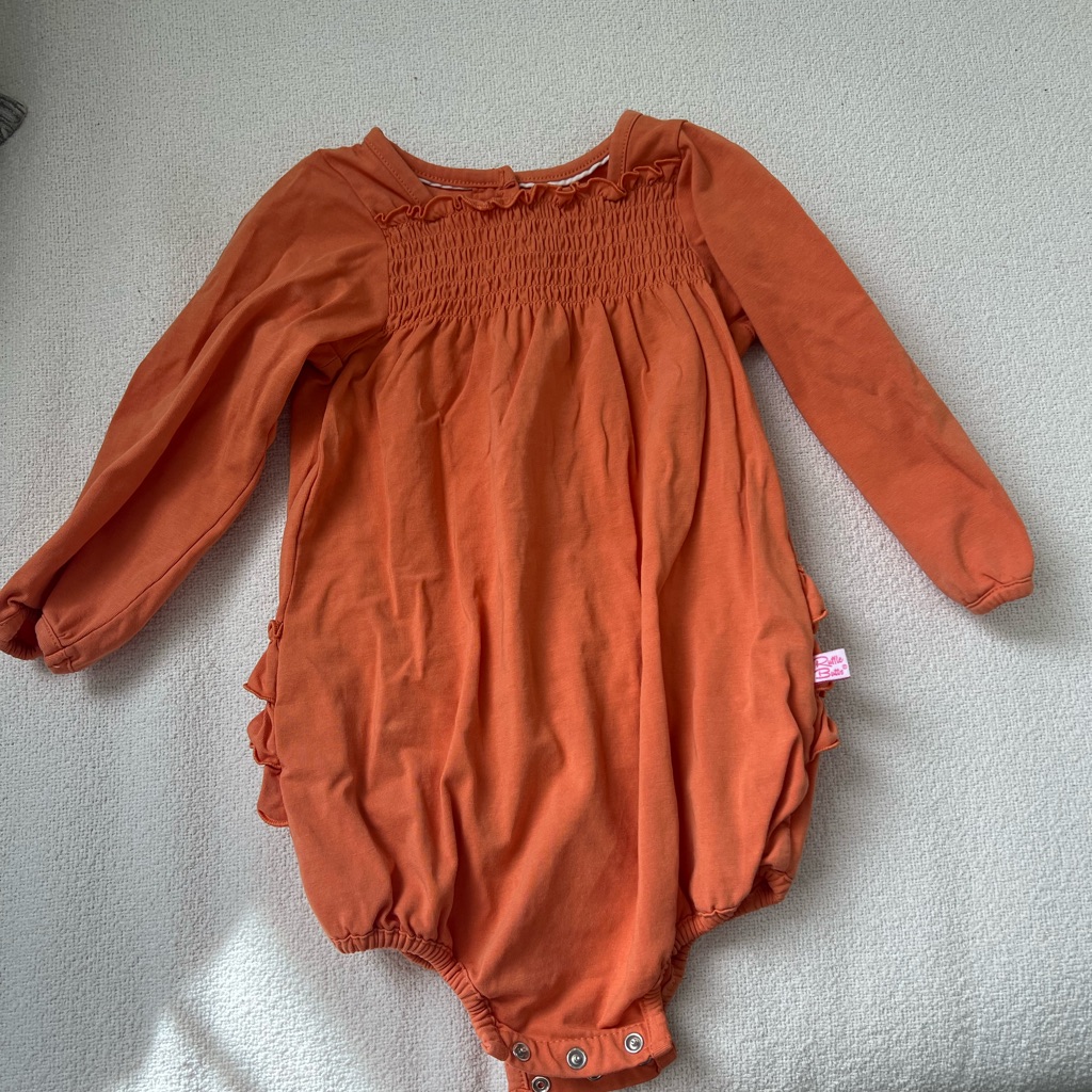 Orange Baby Romper With Ruffle Details